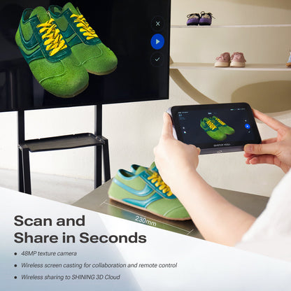 Portable 3D scanner scanning a dental model, showing detailed mesh on the display