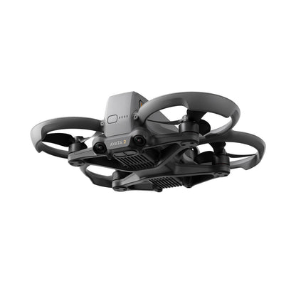 FPV drone and accessories laid out flat, including batteries, props, and cables