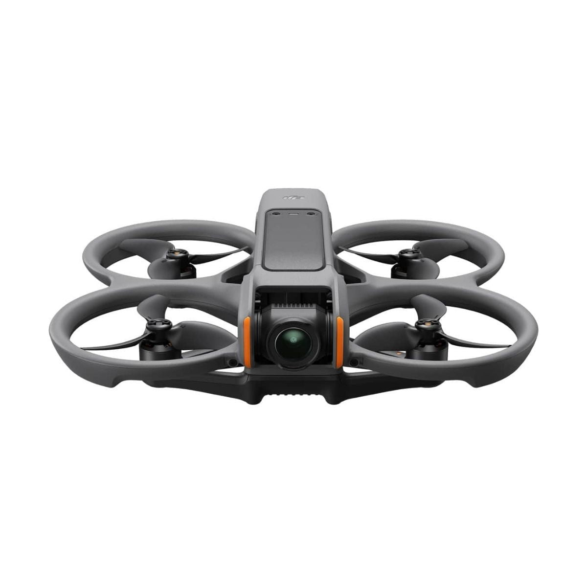 FPV drone kit shown with three batteries, charging hub, and controller on a table