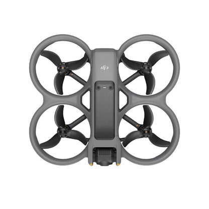 Palm-sized FPV drone with camera and propeller guards resting on a launch pad