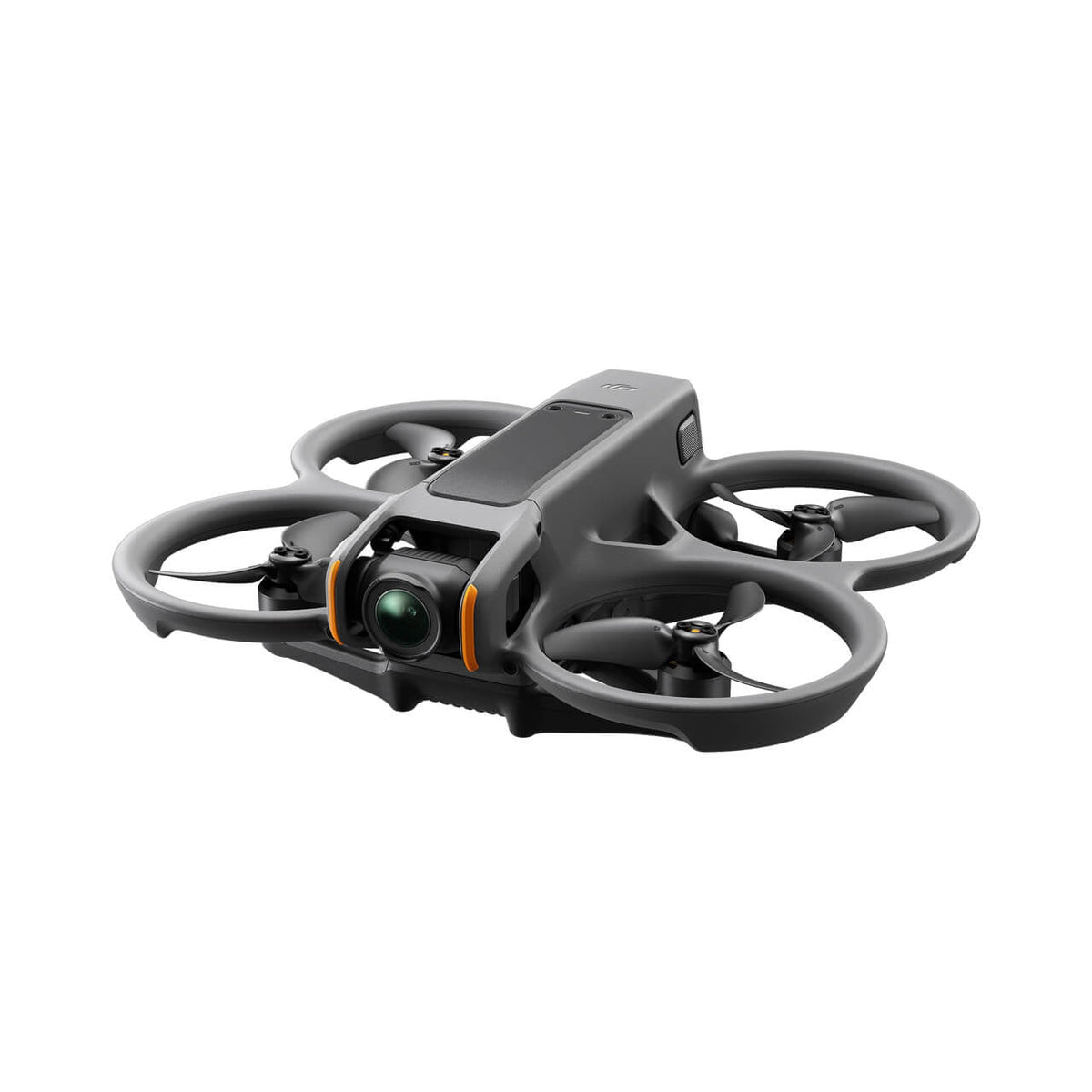 Small FPV camera drone flying fast through an open indoor space