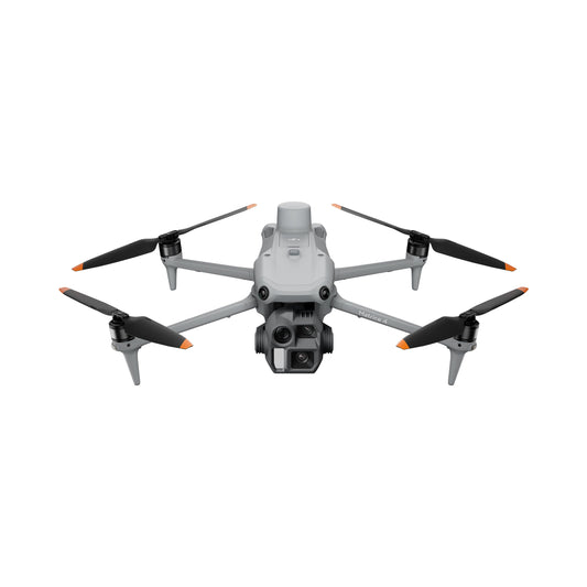 Compact folding enterprise quadcopter with gimbal camera hovering above a survey site